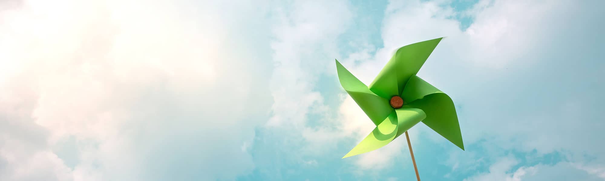 Paper windmill against blue sky