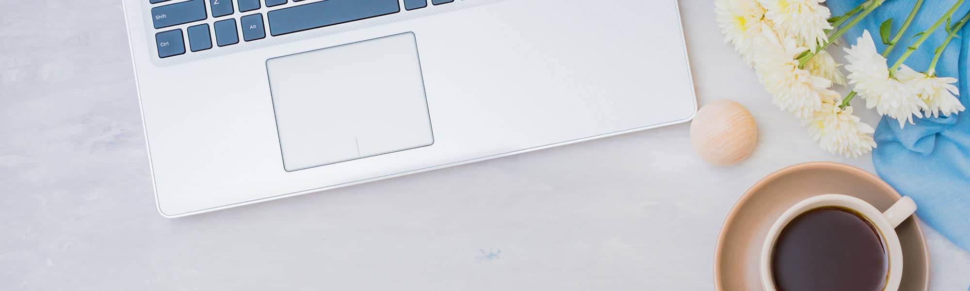 Coffee cup and laptop